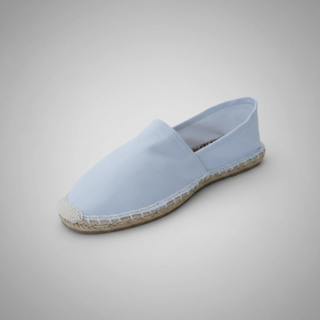 Blue slip-on shoe with a white background