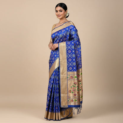 Blue saree with floral patterns on a white background