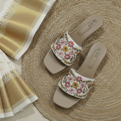 Floral slides with a saree and flowers on a woven mat