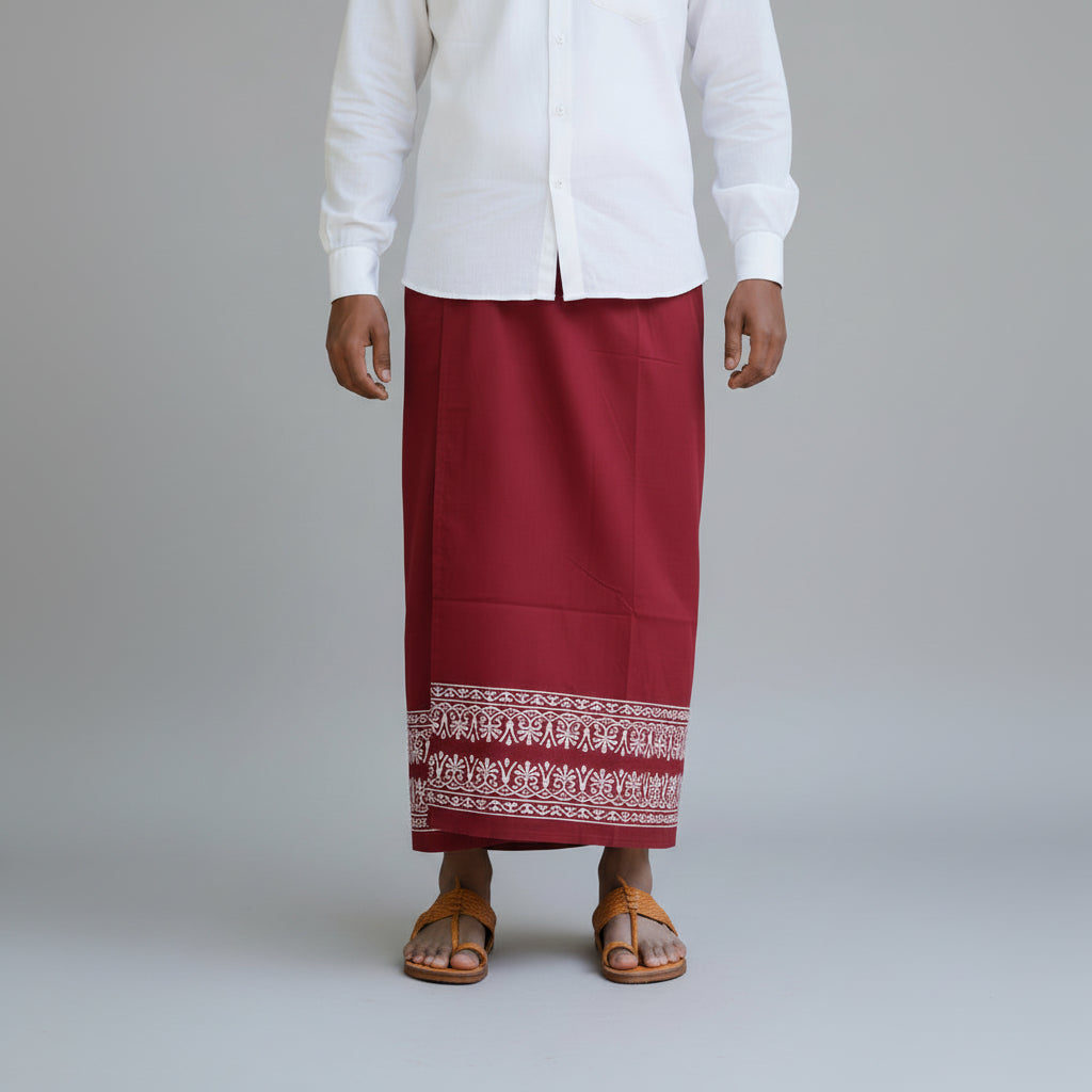 Person wearing a white shirt and red skirt with a patterned hem on a gray background