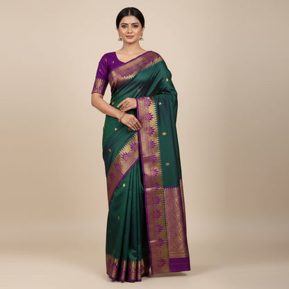 Green and purple saree with a matching blouse on a white background
