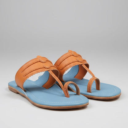 Clear sandal with orange strap on a plain background