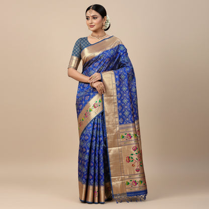 Decorative saree with floral patterns on a blue background