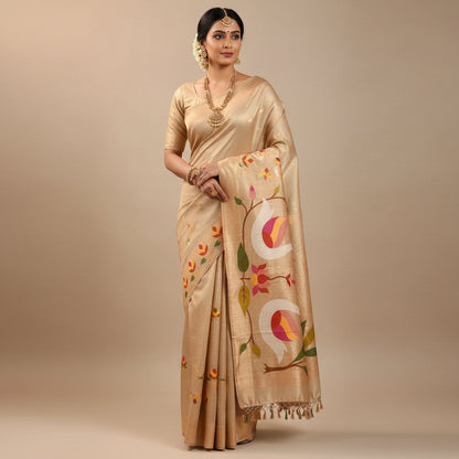 Beige fabric with colourful birds and floral patterns on a white floor.