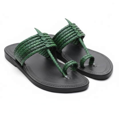 Gray sandal with green braided straps on a light stone surface, featuring Khaal Karagiri branding.