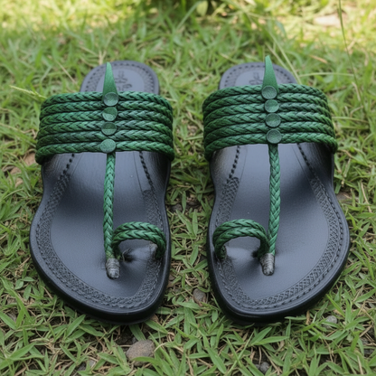 Gray sandal with green braided strap on a light stone surface, featuring Khaal Karagirl logo.