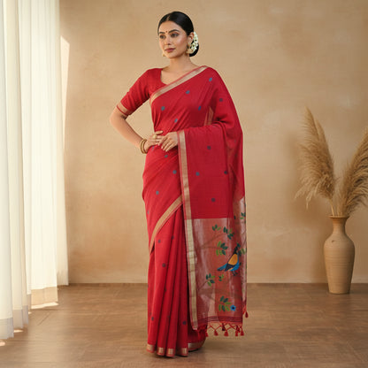 Red saree with bird and floral patterns on a white background