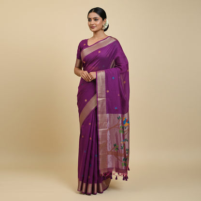 Purple saree with bird and floral patterns on a light background