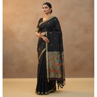 Black saree with colorful bird and tree design on a beige background