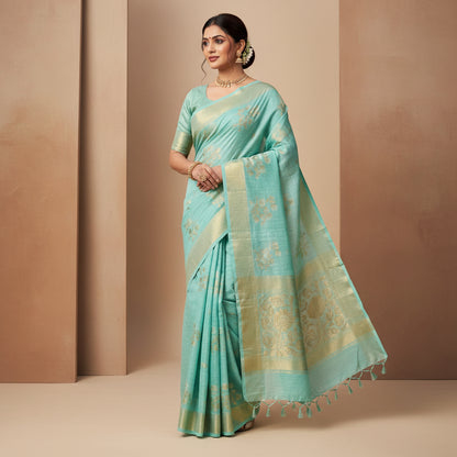 Turquoise saree with gold patterns on a white background