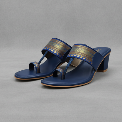 Pair of blue sandals with decorative straps on a white background