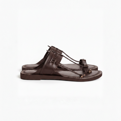 Brown sandal with a thong design on a white background