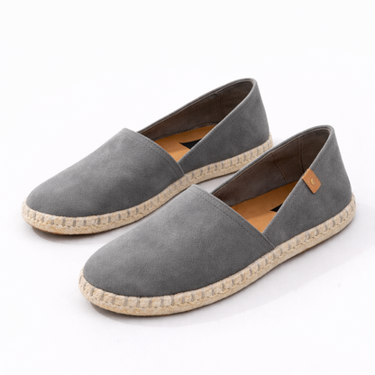 Pair of gray espadrilles on a white background