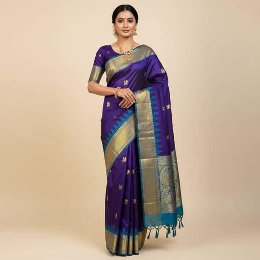 Blue saree with gold patterns on a wooden surface