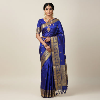 Blue saree with gold patterns on a white surface
