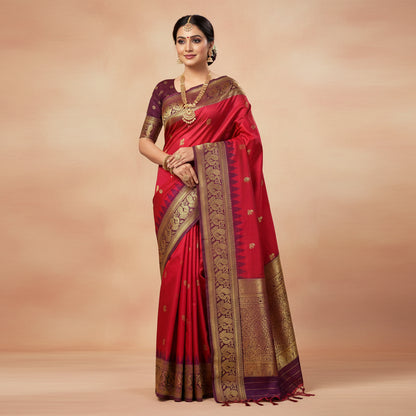 Red saree with gold patterns on a wooden stand